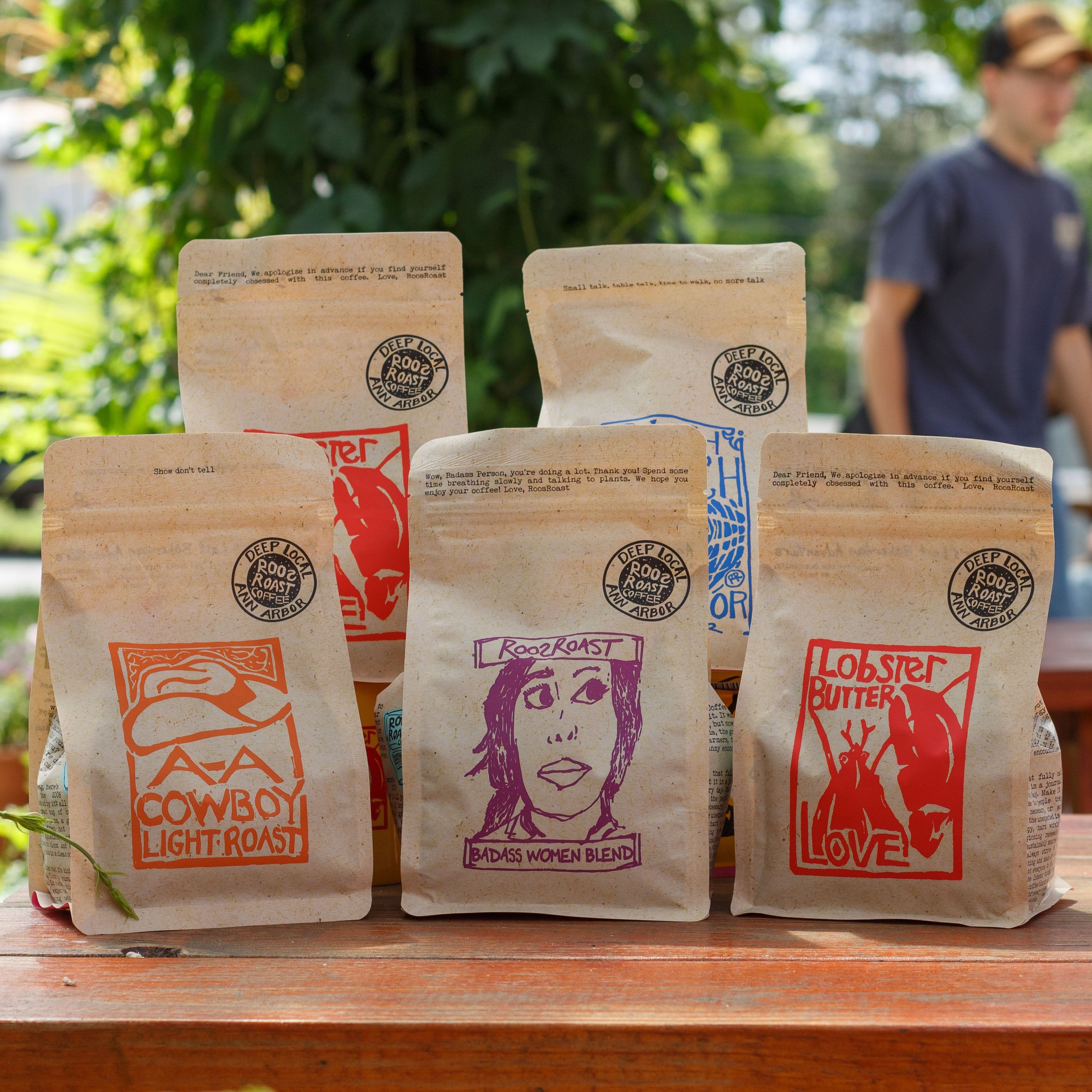 different bags of roosroast coffee together outside