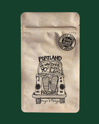 Coffee bag with a vintage truck illustration and 'Portland' text on a green background