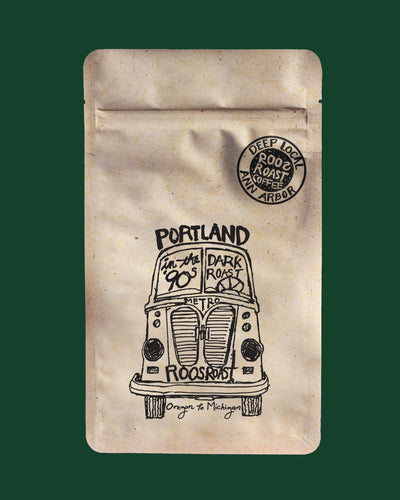 Coffee bag with a vintage truck illustration and 'Portland' text on a green background