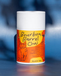 Bourbon Barrel Chai black tea canister with a cat illustration on an orange background