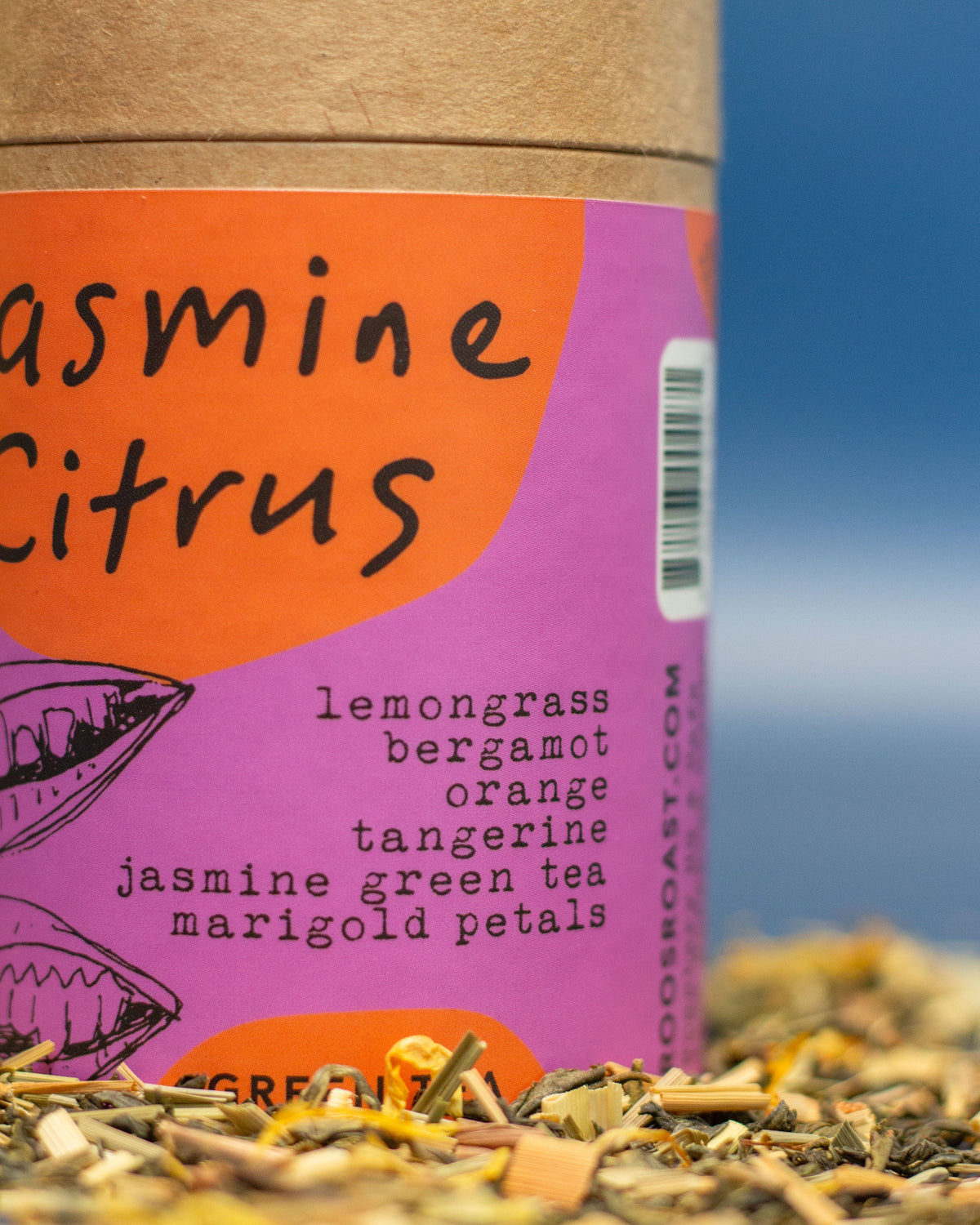 Tea packaging with 'Jasmine Citrus' flavor description and ingredients listed.