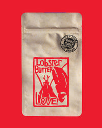 Coffee package with 'Lobster Butter Love' design on a red background