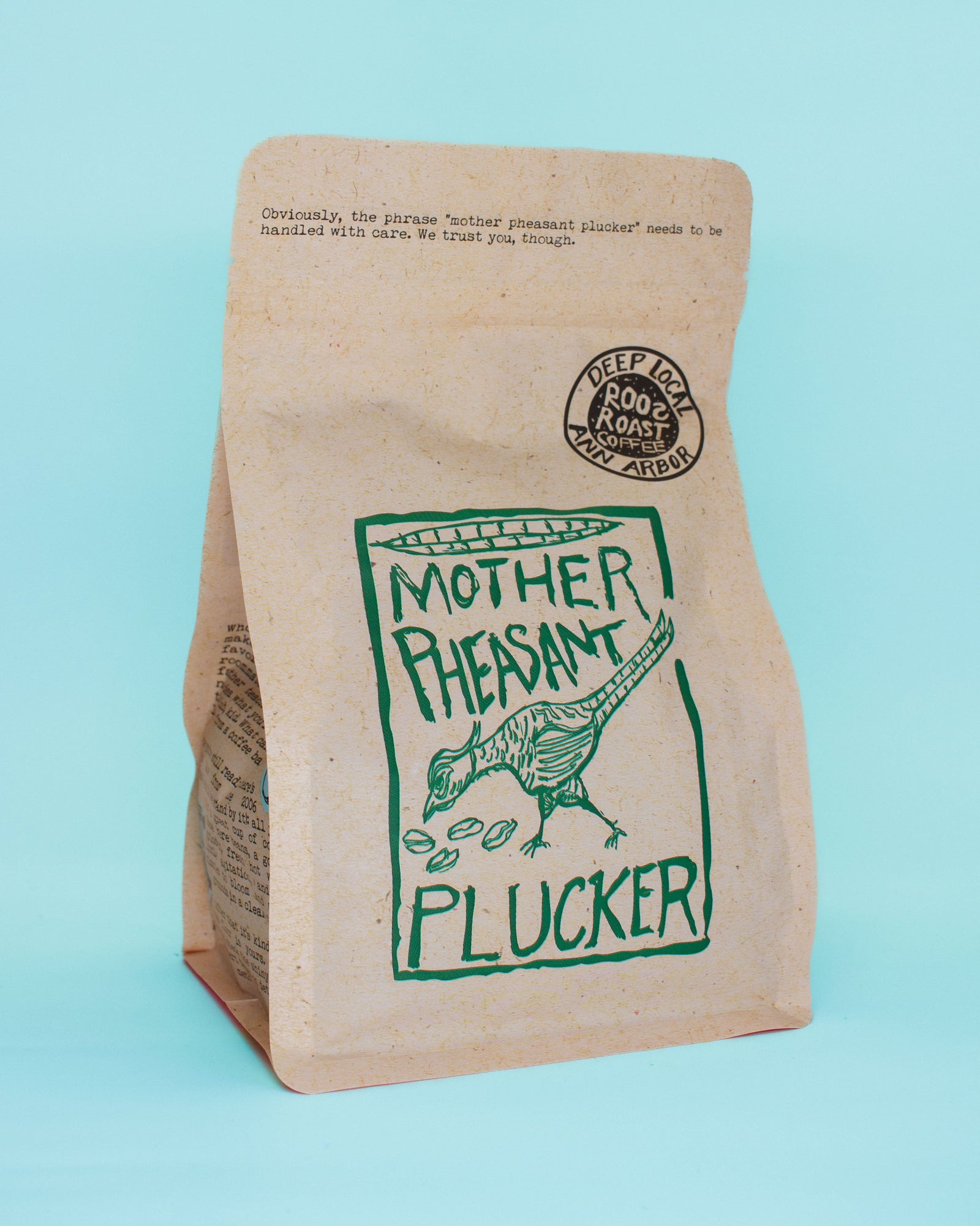 Brown paper bag with green graphics and text on a light blue background