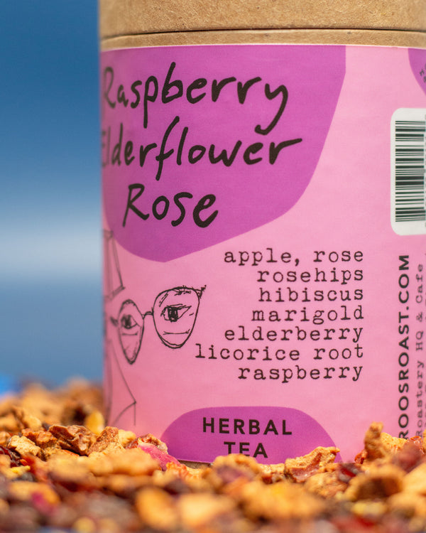 Tea packaging with 'Raspberry Elderflower Rose' flavor and a pink label.