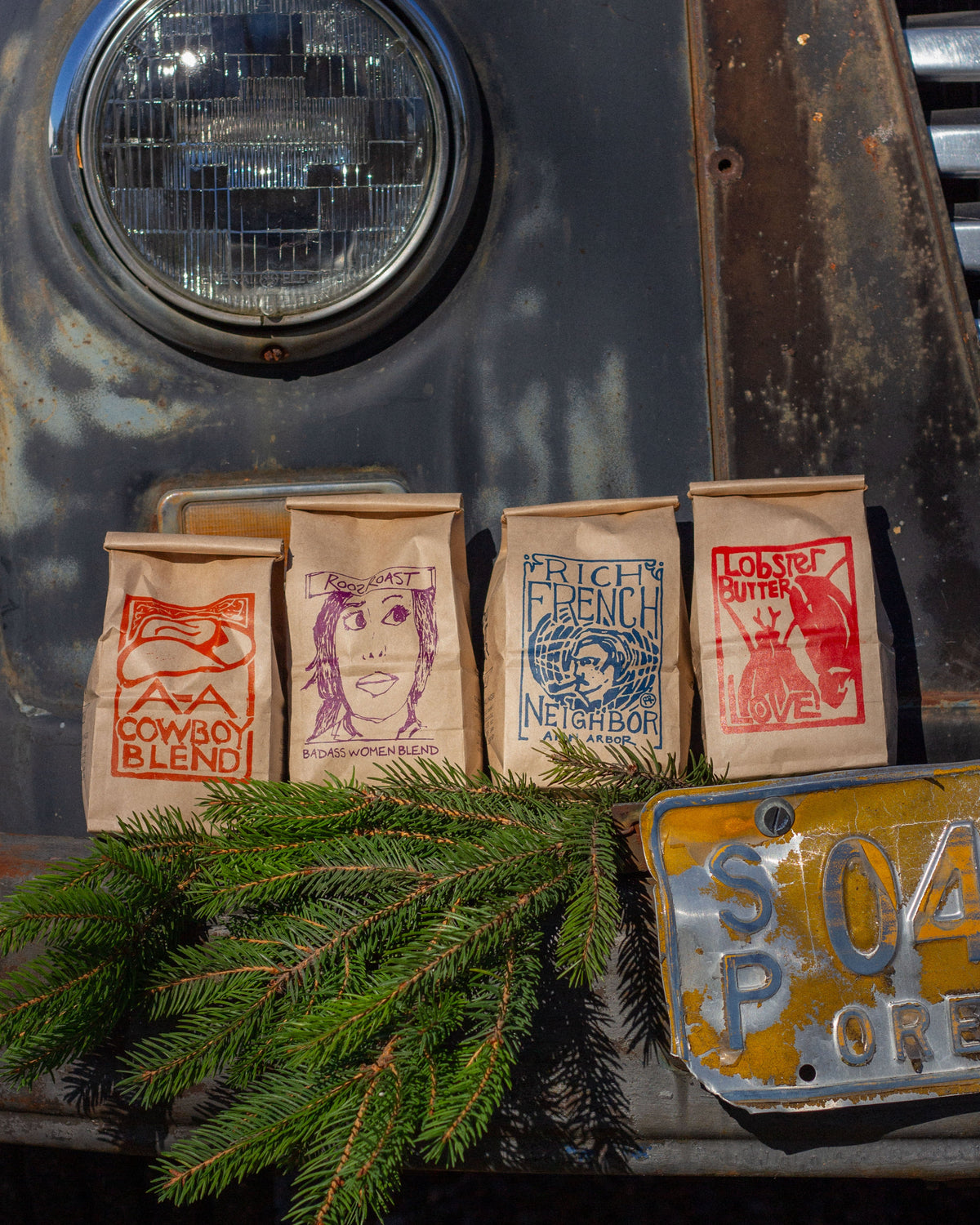 Vintage truck with coffee bags and a license plate, featuring rustic and nostalgic elements.