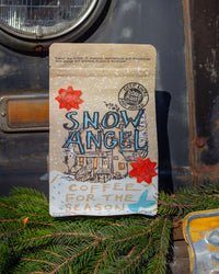 snow angel with bows on the bag