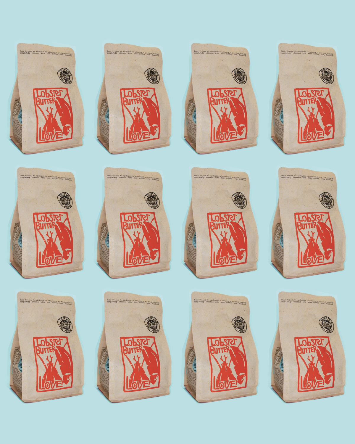 Repetition of a coffee bag with lobster butter lover branding on a light blue background
